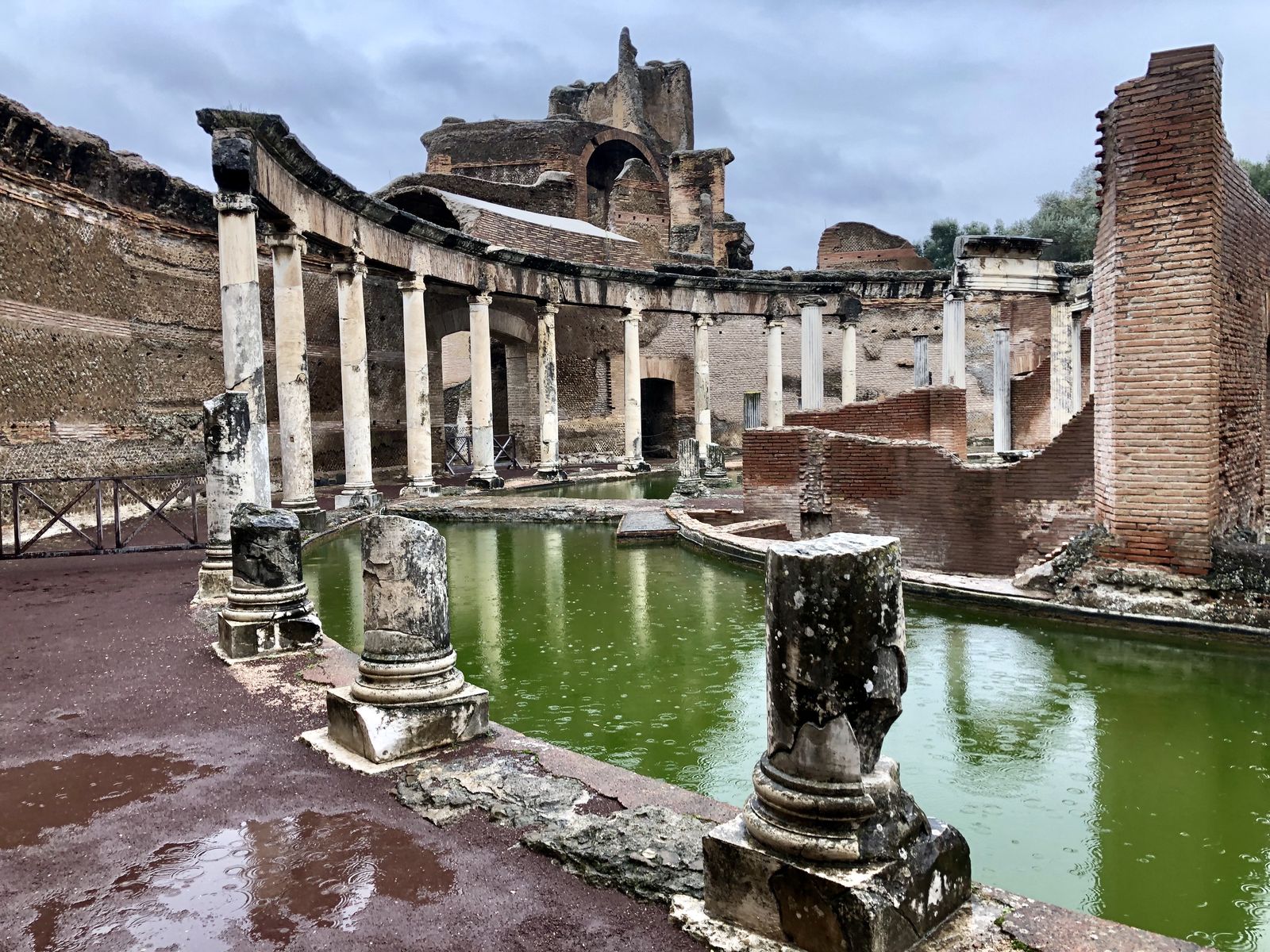 The surviving Ionic colonnade of the Teatro Marittimo with the moat and island beyond