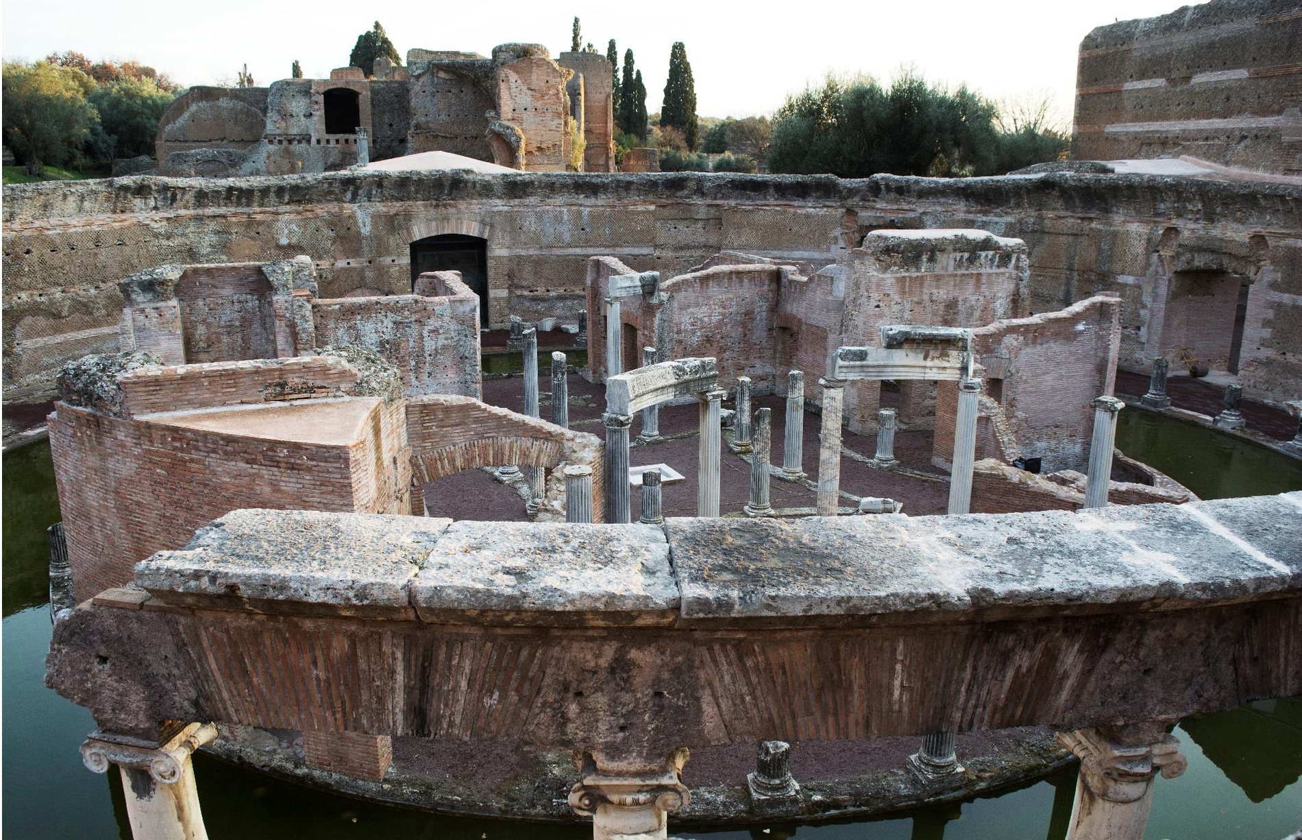 High oblique view of the Teatro Marittimo from the top of the enclosure wall, the moat encircling the island villa